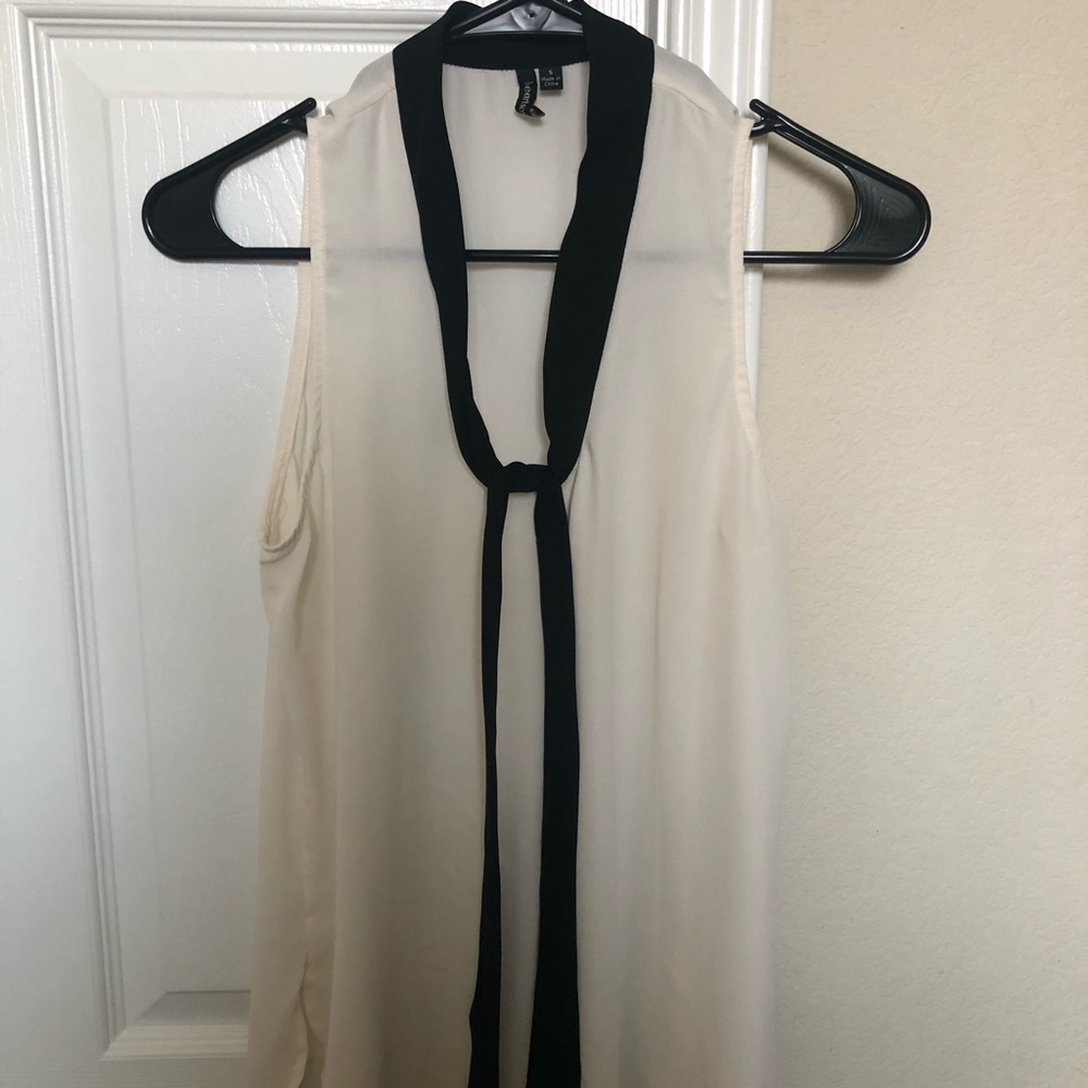 Cream colored blouse with front tie straps